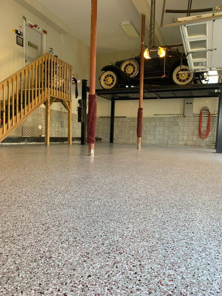 Garage with polished floor and vintage car
